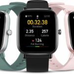 três amazfit gts 2 mini nas cores preto, rosa e verde